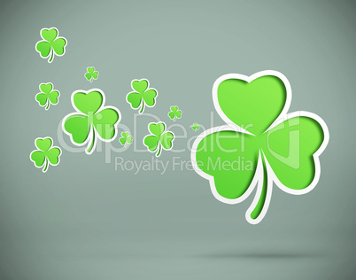 Green shamrocks on grey background