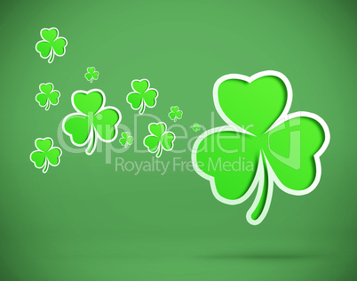 Green shamrocks on green background