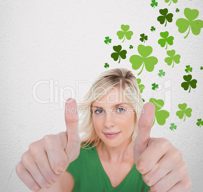 Girl in green t-shirt giving thumbs up with copy space