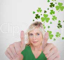 Girl in green t-shirt giving thumbs up with copy space