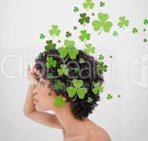 Girl looking into distance with shamrocks