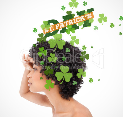 Girl looking into distance with shamrocks coming from her hair a