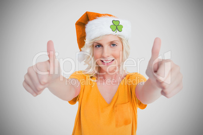 Girl in orange t-shirt giving thumbs up
