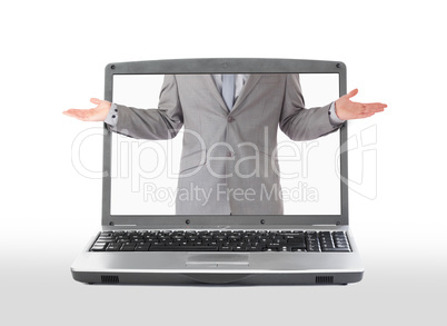 Businessman reaching his arms out questioningly from laptop