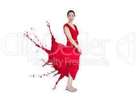 Asian woman smiling with red dress turning to paint splatter