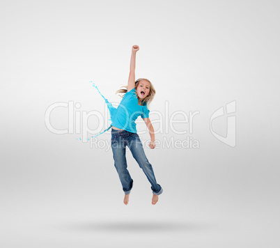 Little girl jumping with clothes turning to paint splashes