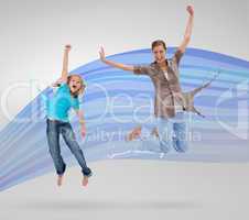 Woman and daughter jumping with clothes turning to paint splatte