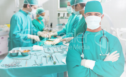 Surgeon standing with his arms crossed