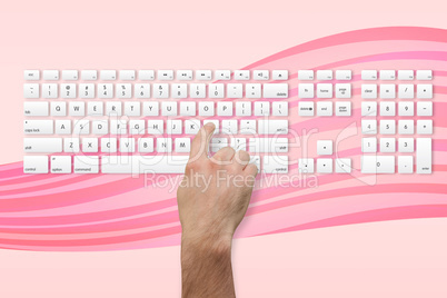 Hand pressing the l key on keyboard