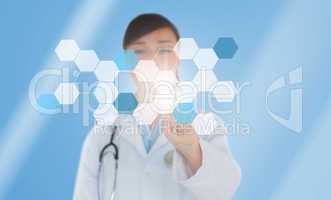 Brunette doctor pressing touchscreen