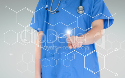Nurse using touchscreen displaying hologram of chemical formula