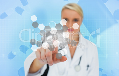 Doctor using touchscreen displaying chemical formula