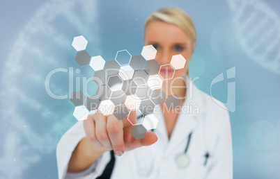 Blonde doctor selecting touchscreen displaying chemical formula