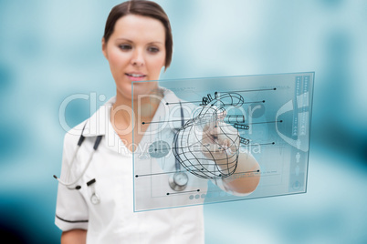 Serious nurse using a futuristic interface