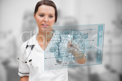 Concentrated nurse working on a medical interface