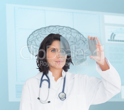 Doctor using a new technology in front of brain sketch