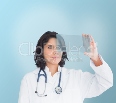 Brunette doctor looking at a screen