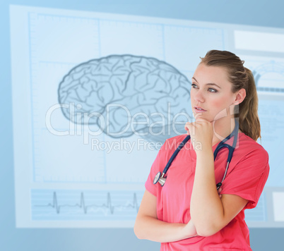 Nurse thinking in front of a futuristic interface