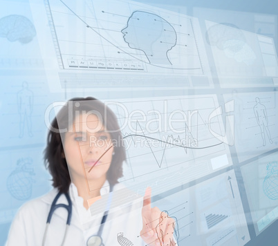 Woman doctor using futuristic interfaces