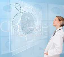 Woman doctor using a futuristic interface