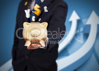 Businessman holding a piggy bank with currencies