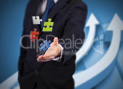 Businessman with digital puzzles