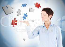Well dressed woman with puzzles levitating