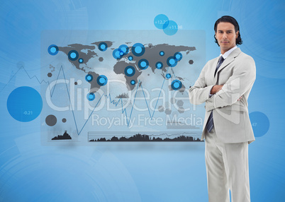 Serious businessman standing with a digital world map