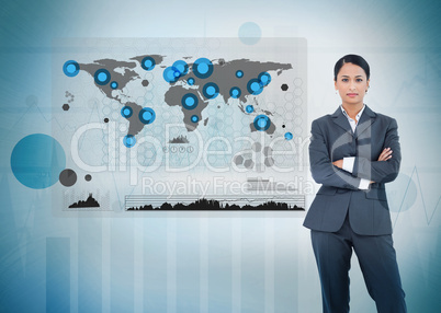 Serious businesswoman standing with a digital world map