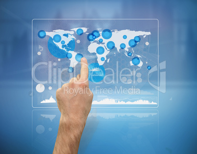 Hand pointing a futuristic screen with the world map