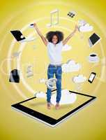 Happy woman jumping on a tablet pc