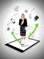 Cheerful businesswoman holding a coffee on a tablet pc