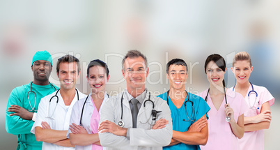 Medical team standing arms crossed in line Medical team standing arms crossed in line