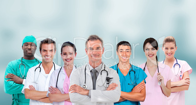 Mixed group of medical workers standing arms crossed