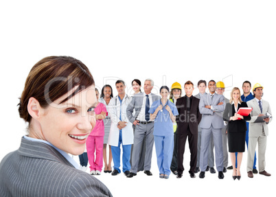 Smiling businesswoman ahead a group of people with different job