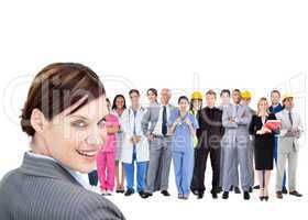 Smiling businesswoman ahead a group of people with different job