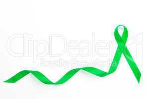 Green awareness ribbon with trail
