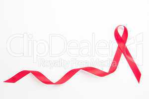 Red awareness ribbon with trail