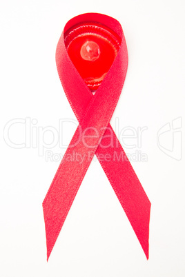 Red aids ribbon with condom