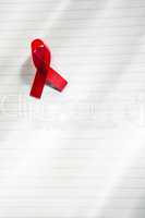 Awareness ribbon for aids on notepad