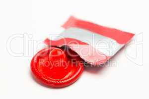 Red condom with wrapper