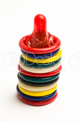 Stack of many colourful condoms