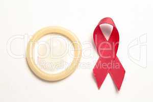 Red awareness ribbon and condom