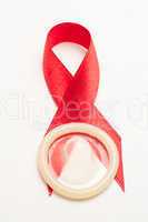 Red awareness ribbon with condom