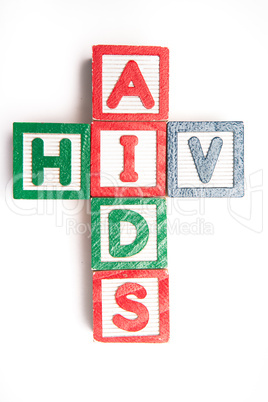 Wood blocks spelling aids and hiv in a cross shape