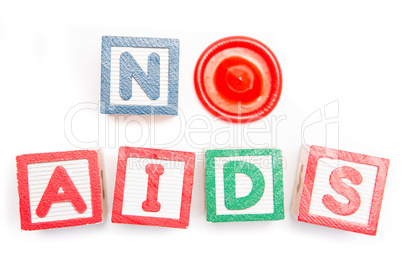 No aids spelled out in blocks and a condom
