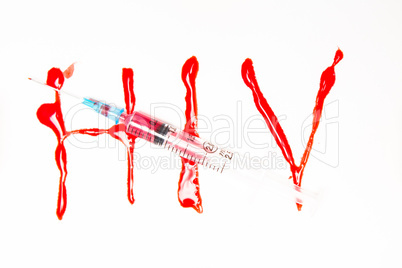 HIV spelled out in blood and syringe filled with blood
