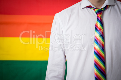 Man wearing shirt and rainbow tie