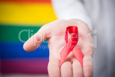Man holding red awareness ribbon