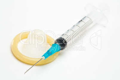 Medical syringe and a condom